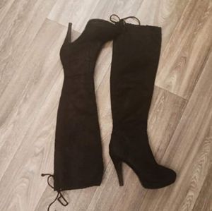 Thigh high black heeled boots